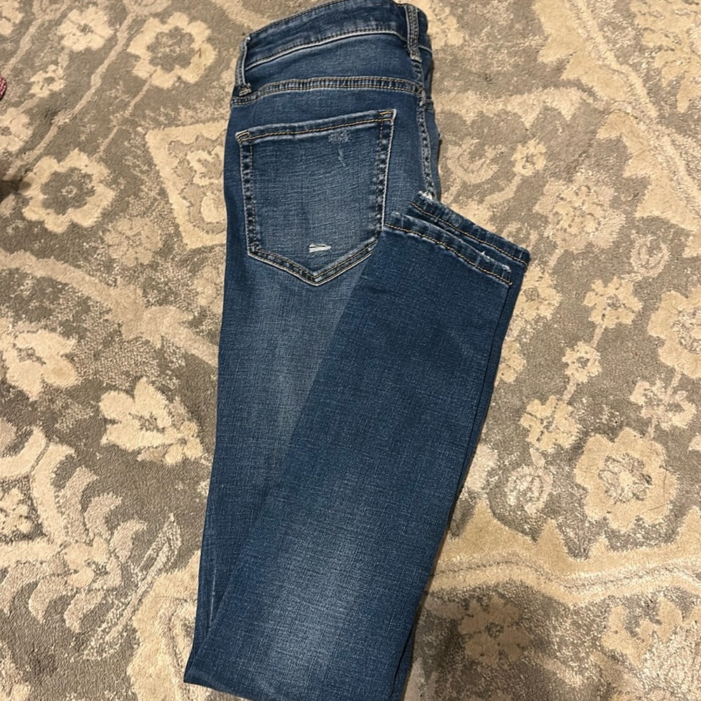 Buckle Skinny Jeans
